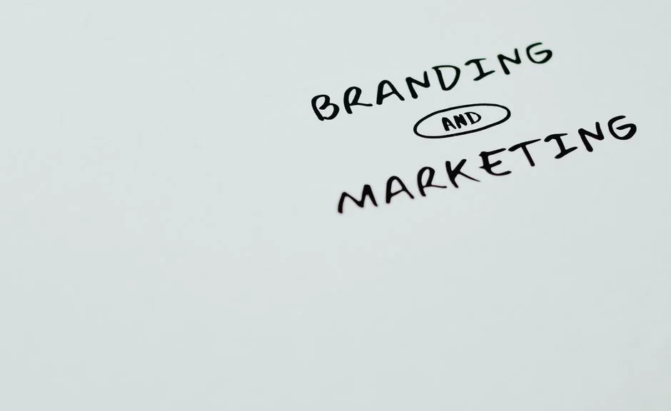 A minimalist image featuring the words 'Branding' and 'Marketing' on a white background, ideal for digital marketing themes.