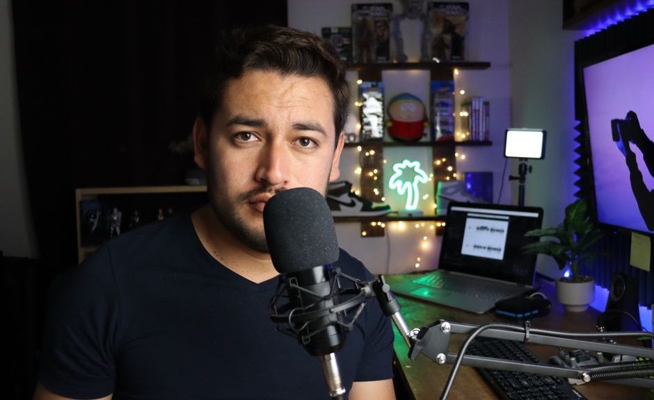 Podcaster in a stylish home studio with microphone and neon lights in Santiago de Querétaro, Mexico.