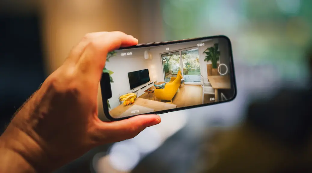 A person taking a picture of a living room