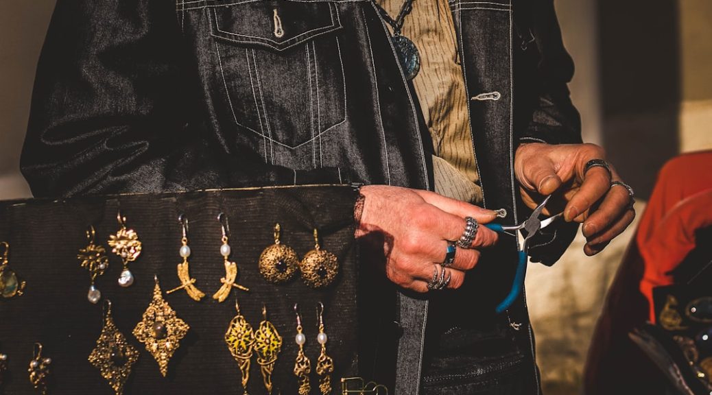 person using blue handled pliers